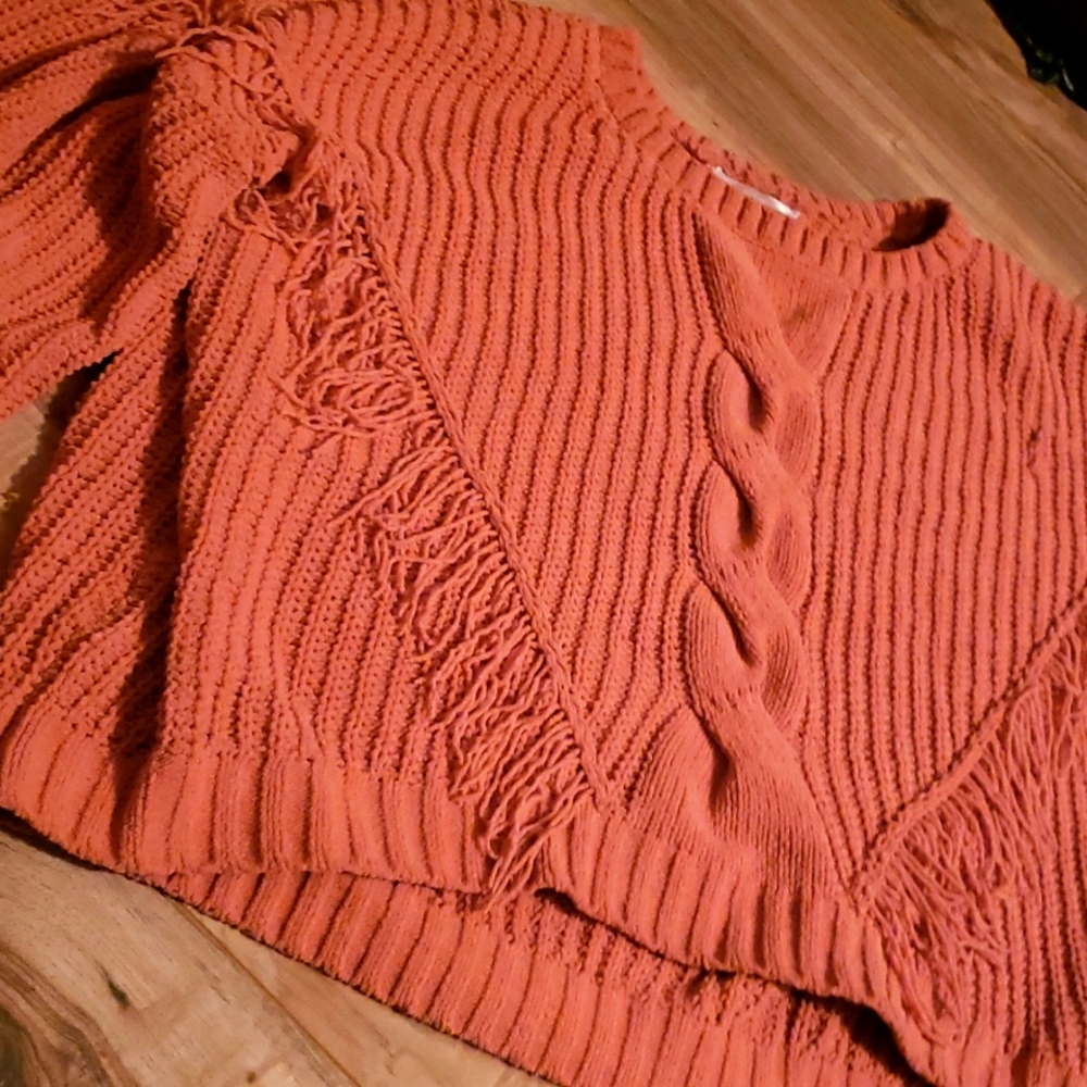Soft peach colored sweater with fringe